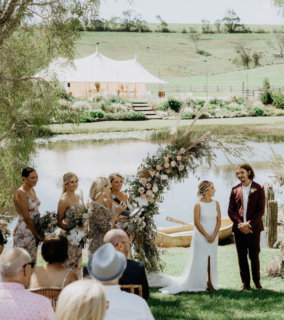 Wedding ceremony couple infront of a lake.